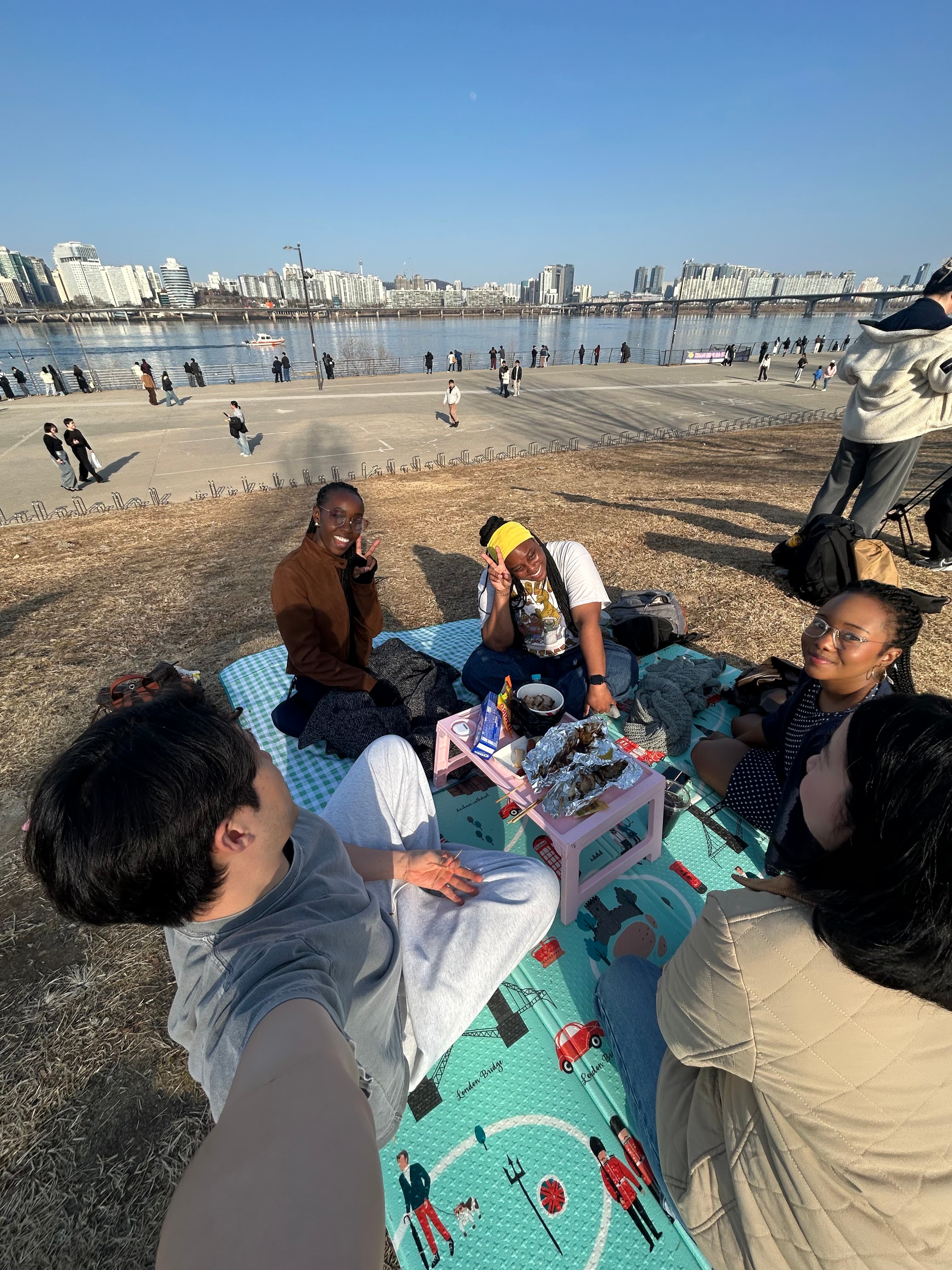 Community members making dumplings at KND Seollal tteokguk party