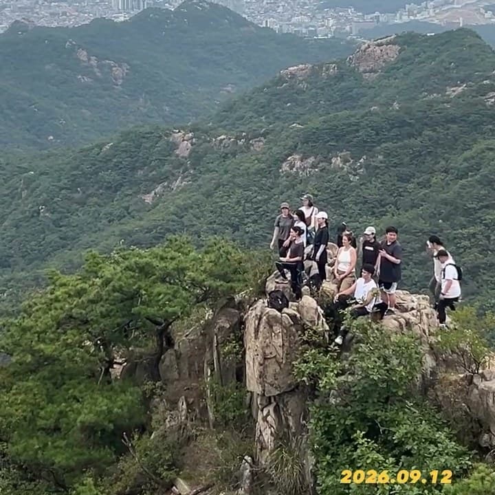 KND hikers gathered on a rocky peak above Seoul in September 2026